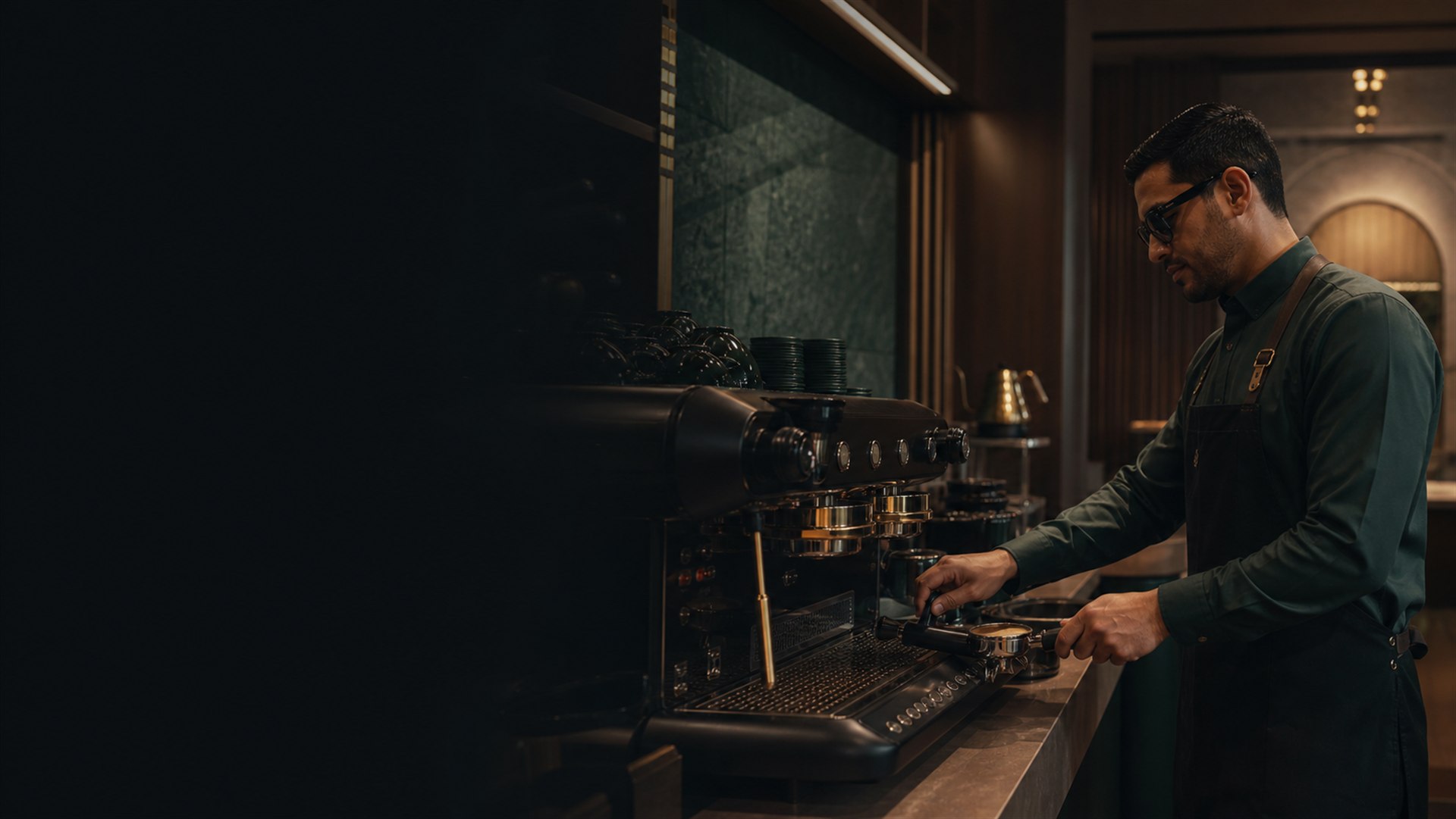 A professional barista with vision impairment working independently at a tactile commercial espresso station.